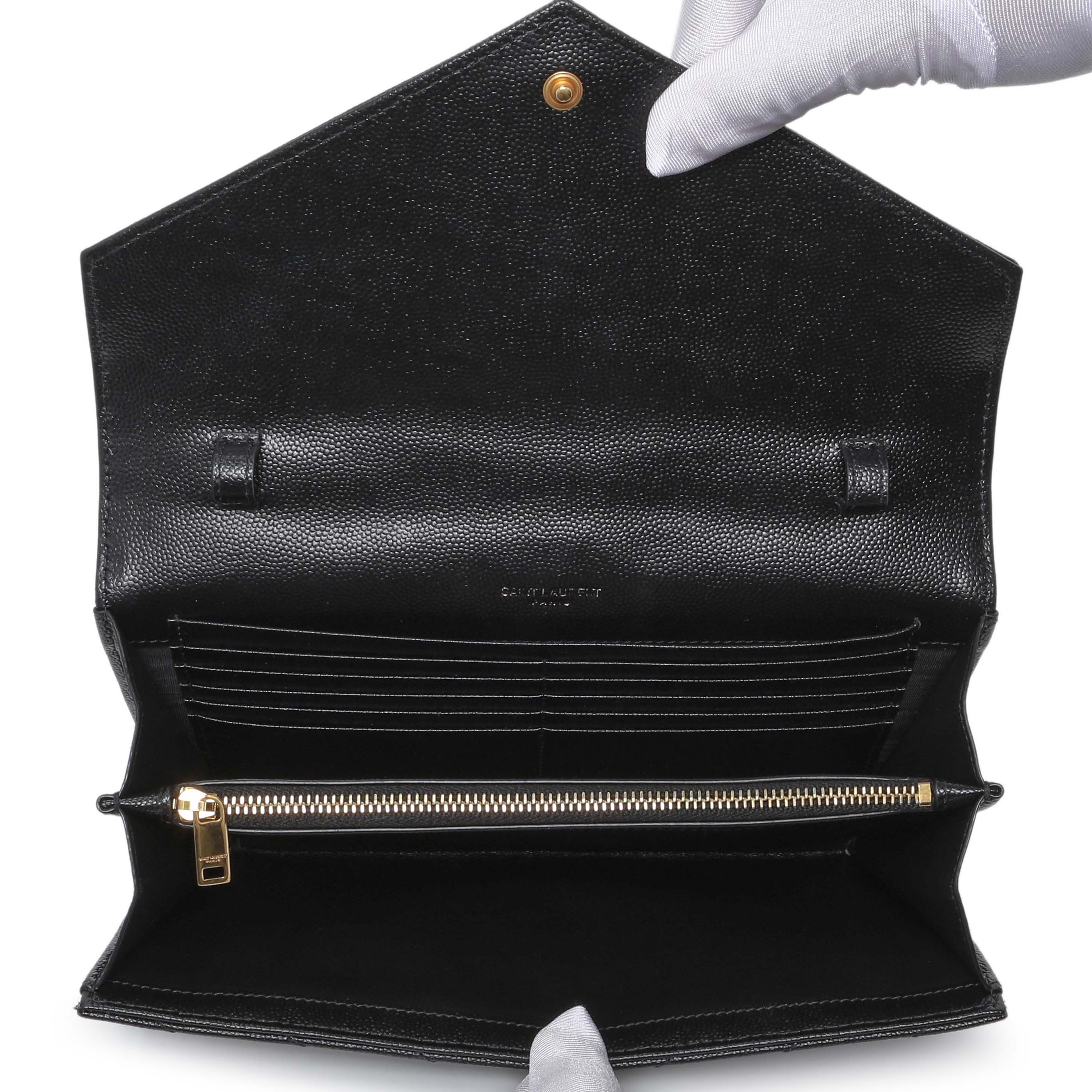 monogram saint laurent chain wallet in black grain de poudre textured matelassé leather
