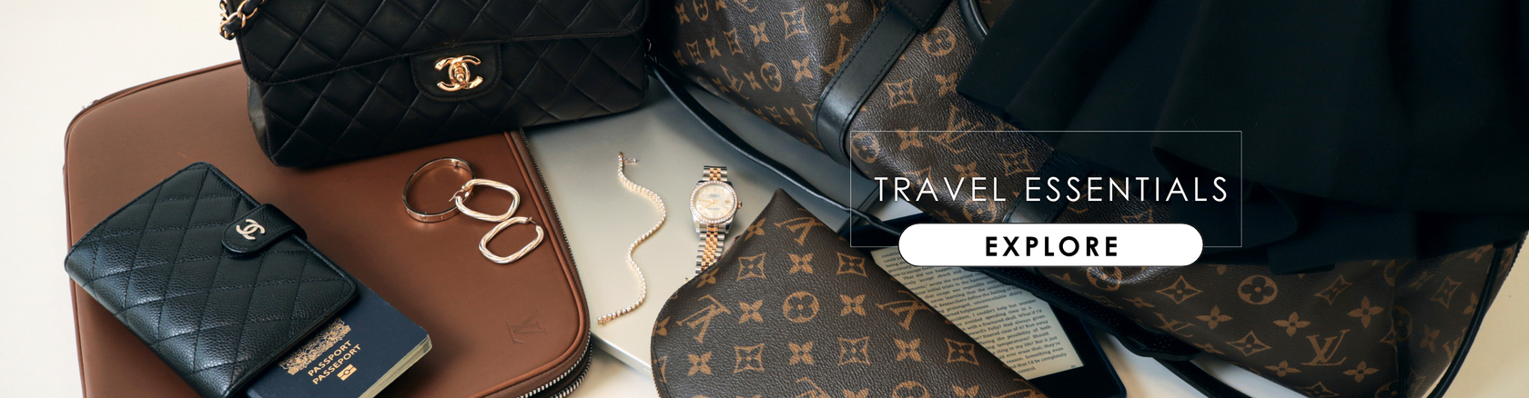 Winter travel essentials flat lay from Modaselle: pre-owned Louis Vuitton monogram travel bag and pouch, Chanel black classic flap bag and wallet, gold watch and jewelry